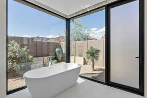 Sunroom with a mountain view