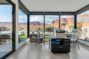 Home office with a mountain view, recessed lighting, and a wall of windows