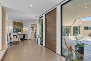 Doorway featuring concrete floors and recessed lighting