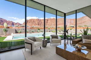 Sunroom featuring a mountain view