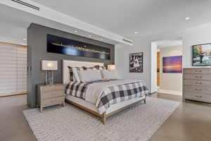 Bedroom featuring recessed lighting and concrete floors