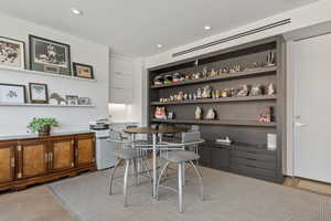 Office area with recessed lighting and light carpet