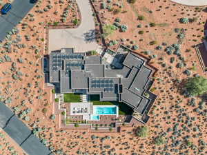 Aerial view of property and surrounding area featuring a pool