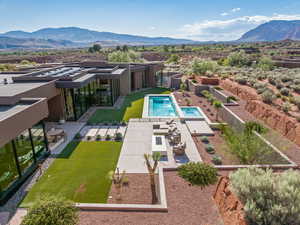 View of swimming pool with a fenced backyard, a patio area, and a mountain view