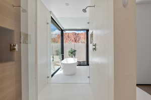 Hallway with tile patterned floors and a mountain view