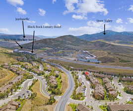 Aerial perspective of suburban area with a mountainous background