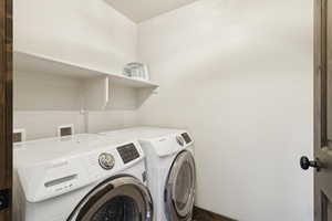 Laundry room with washing machine and dryer