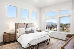 Bedroom with a mountain view and recessed lighting