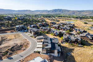 Aerial perspective of suburban area with a mountain backdrop