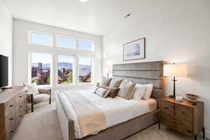 Carpeted bedroom featuring a mountain view