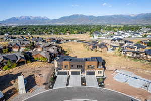 Aerial perspective of suburban area featuring a mountainous background
