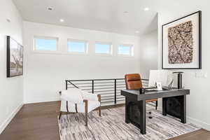 Office space with recessed lighting and wood finished floors