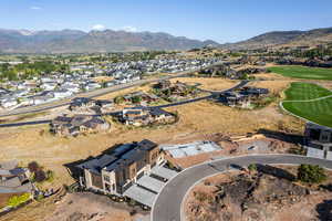 View of property location featuring a mountainous background and nearby suburban area
