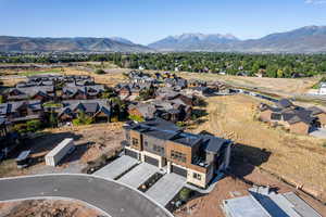 Aerial view of residential area featuring a mountain backdrop