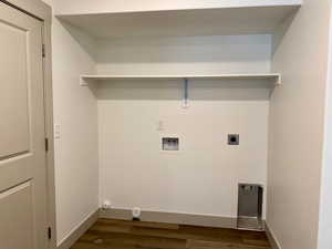 Laundry area featuring dark wood-type flooring, hookup for a washing machine, and hookup for an electric dryer