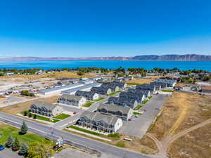 Aerial perspective of suburban area featuring a water and mountain view