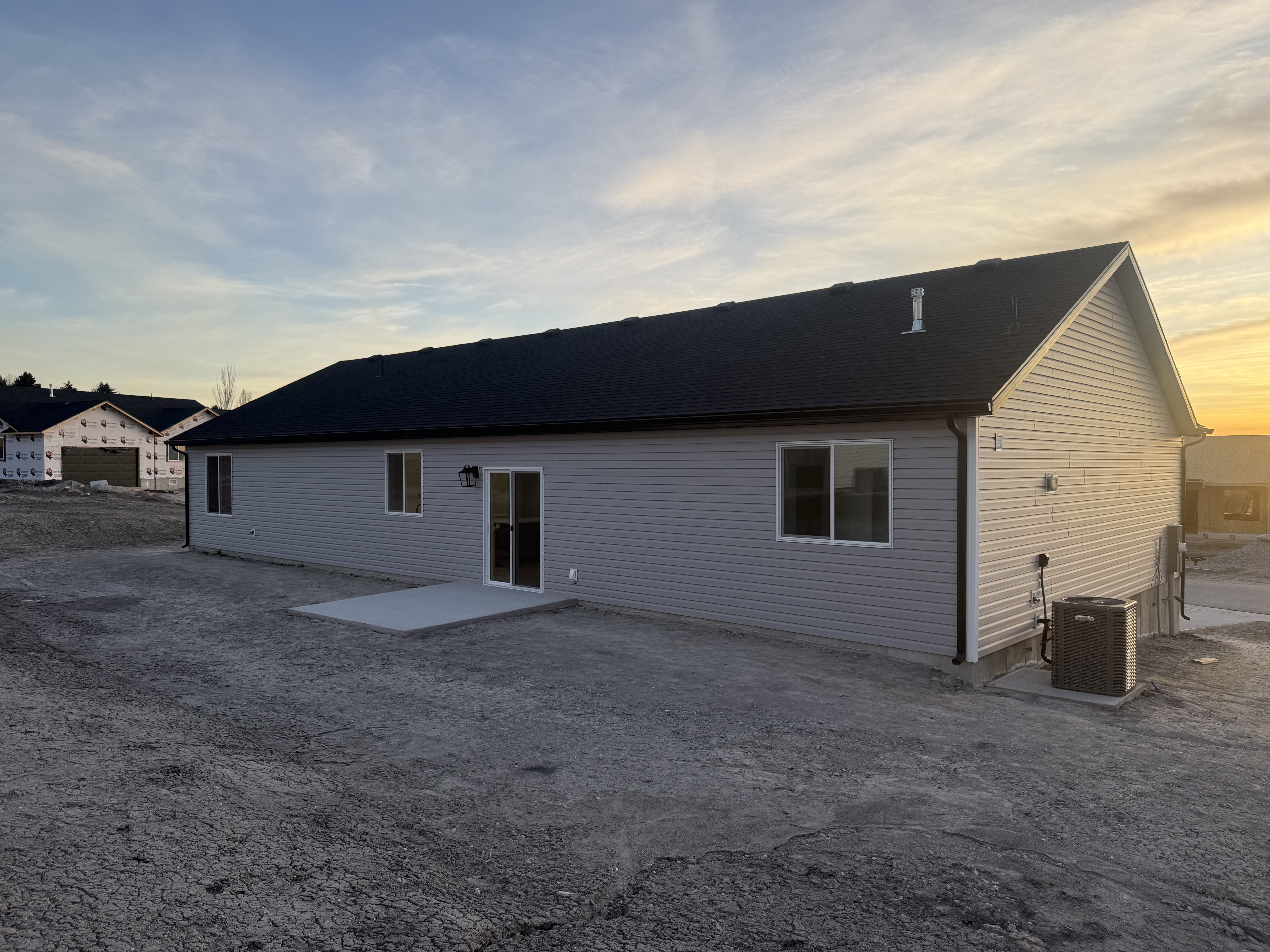 Back of property with a patio