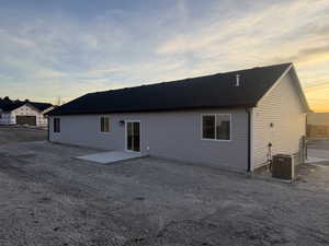 Back of property with a patio