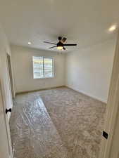 Master bedroom with carpet, a ceiling fan, and recessed lighting