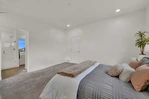 Carpeted bedroom featuring baseboards and recessed lighting