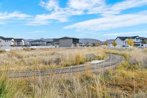 View of yard featuring a residential view and a mountain view