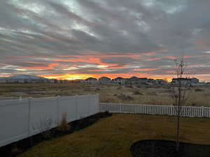 Fenced backyard with a residential view