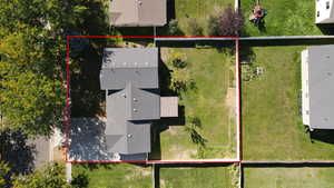 Aerial view of property and surrounding area with property parcel outlined