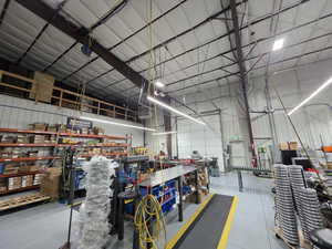 Garage with metal wall and a workshop area