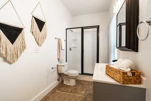 Bathroom featuring a stall shower and vanity