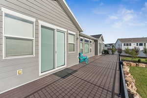 View of patio with a wooden deck