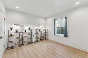 Interior space with light wood-style floors and recessed lighting