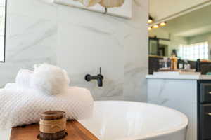 Bathroom with a freestanding bath and vanity