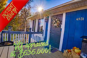 Doorway to property featuring a wooden deck