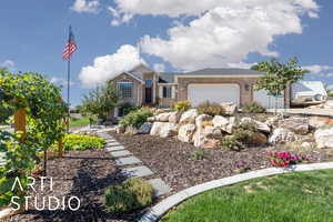 Brick  and stucco exterior with 3 car garage