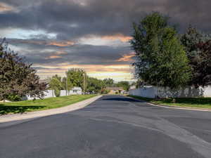 View of asphalt road with curbs
