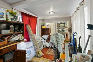 Miscellaneous room with dark wood finished floors and a textured ceiling