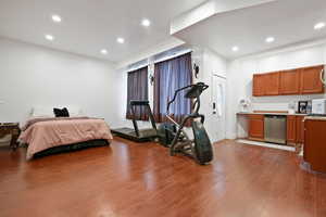 Bedroom featuring recessed lighting and dark wood-style flooring