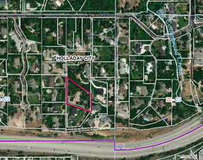 Aerial view of property's location featuring property parcel outlined