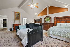 Bedroom featuring high vaulted ceiling, beam ceiling, ceiling fan, and light colored carpet