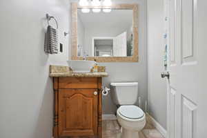 Half bath with vanity and toilet