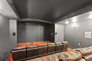 Home theater room featuring electric panel and recessed lighting