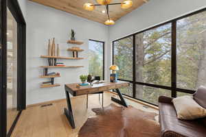 Home office featuring wooden ceiling, light wood-style floors, and recessed lighting