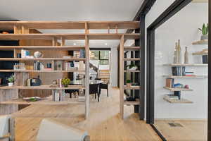 Office area with light wood-type flooring