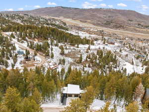 Snowy aerial view with a mountain view