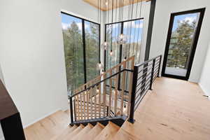 Stairway featuring hardwood / wood-style floors