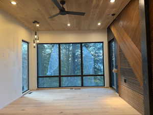 Spare room with recessed lighting, light wood-type flooring, a ceiling fan, and wood ceiling