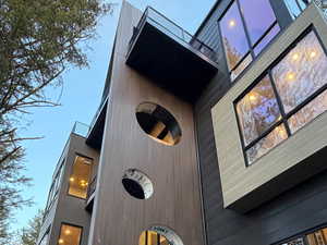 View of property exterior featuring a central AC unit