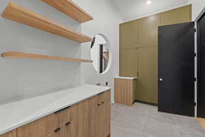 Bathroom featuring vanity and light tile patterned floors