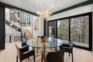 Dining room with a chandelier and light wood finished floors