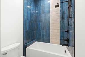 Full bath with toilet and bathtub / shower combination